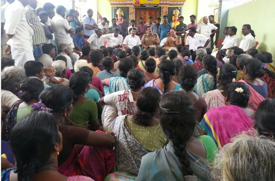 Protesting villagers at the village temple